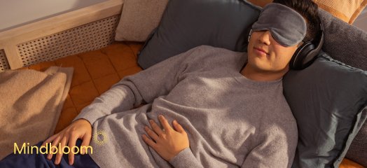 a person laying on pillows as a part of mindbloom therapy session